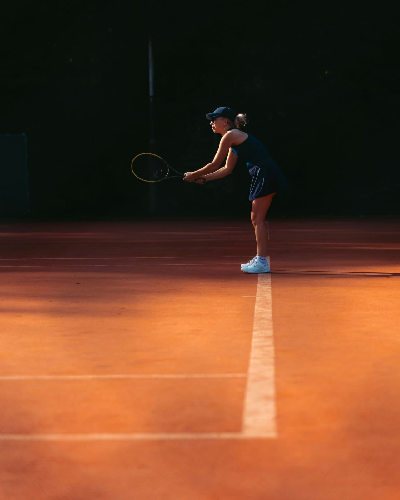 Privatunterricht mit Trainer auf dem Tennisplatz